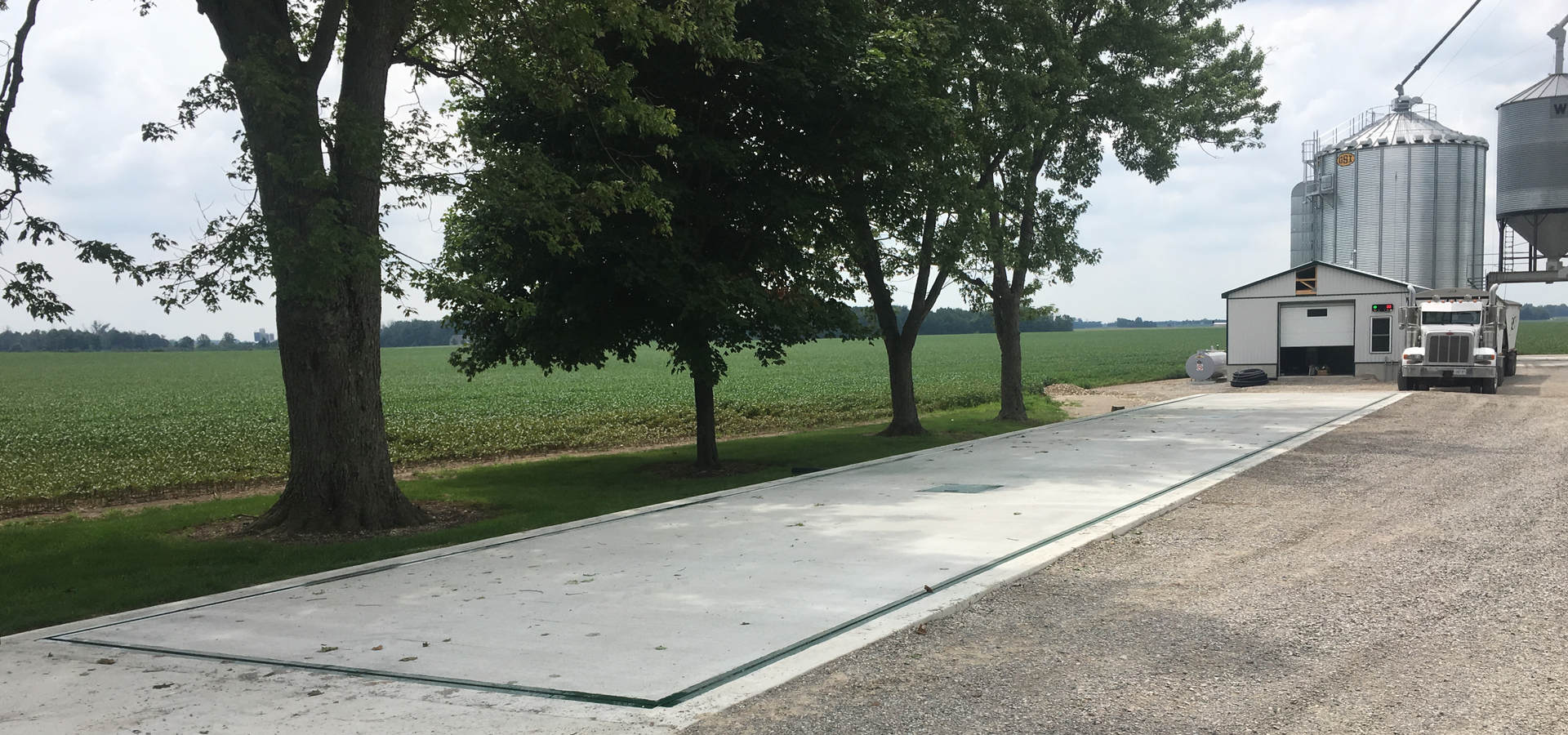 Pit Scale - Concrete deck vehicle scale installed over a pit at an Ontario farm - manhole for access visible in the centre - Ramara Weigh Scale Manufacturing - Heavy Capacity Weighing Scales